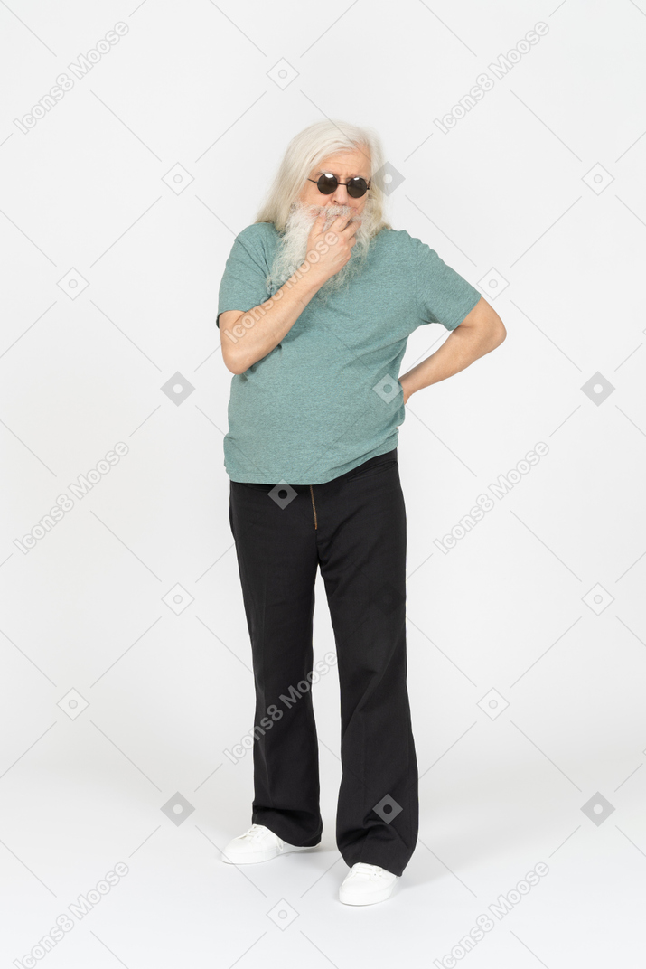 Three-quarter view of old man in sunglasses wondering