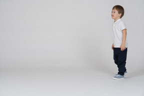 Three-quarter view of a boy walking forward