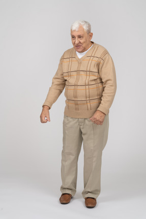 Front view of a happy old man in casual clothes