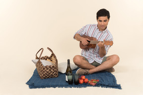 A man playing ukulele