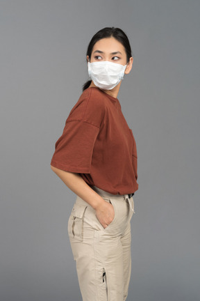 A young woman wearing a face mask