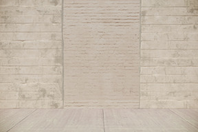 Beige brick wall with a bricked up door