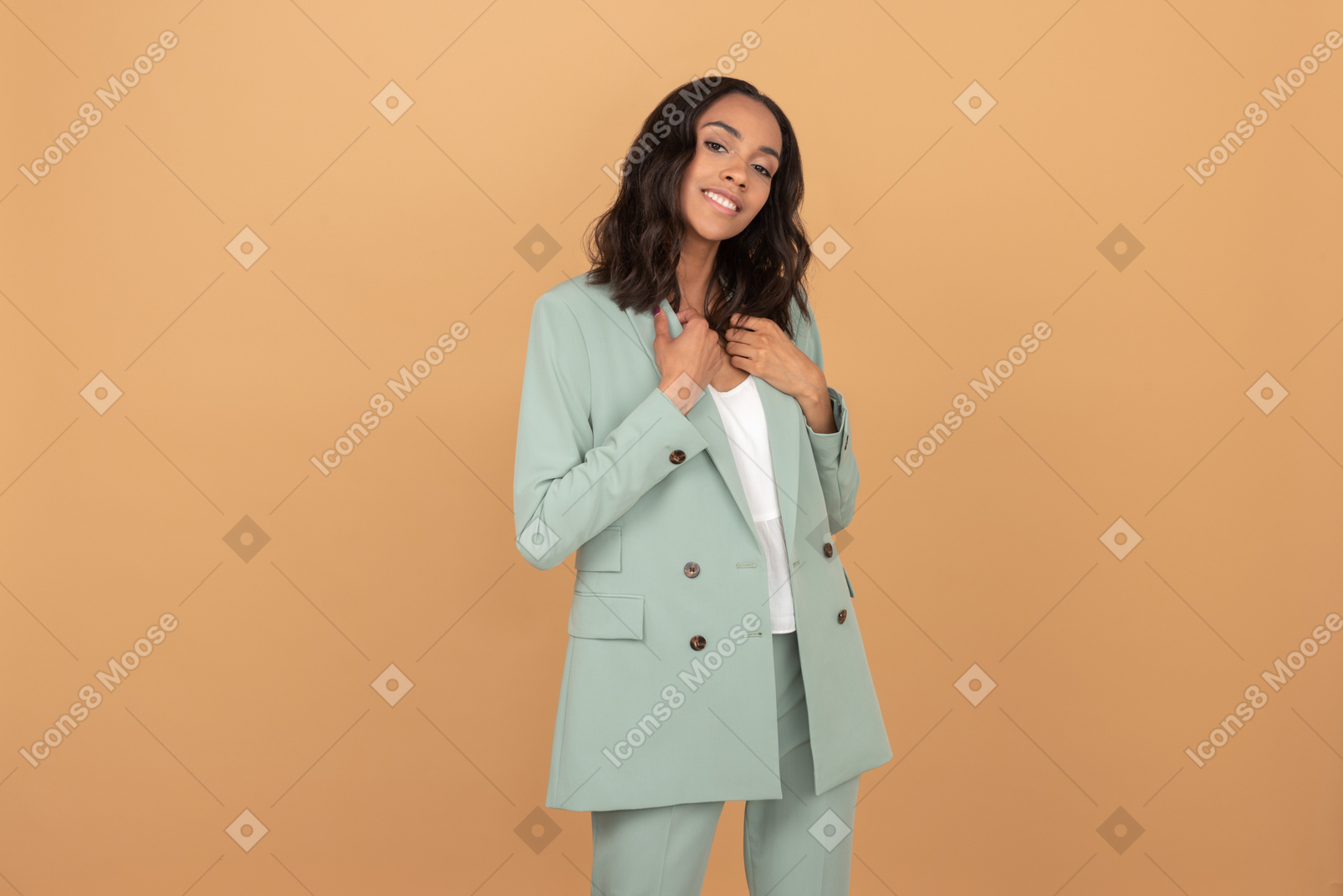 Contented young girl standing holding her jacket's collar