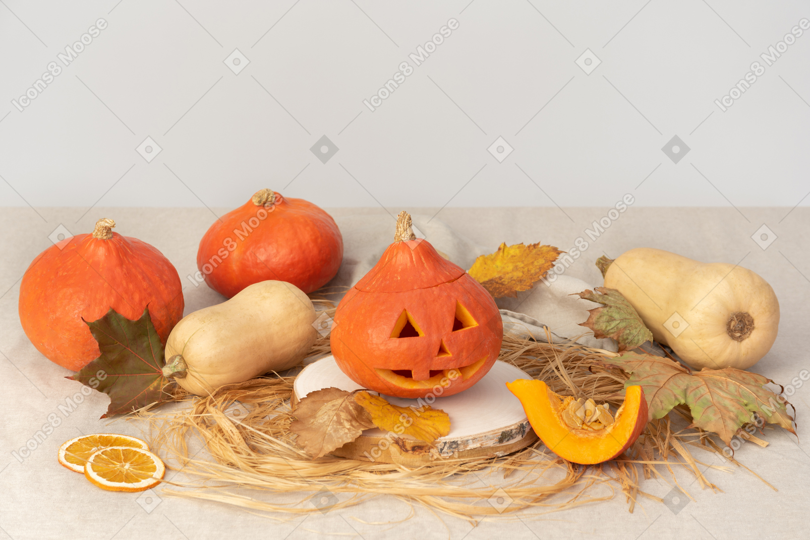 Carved pumpkins and yellow leaves