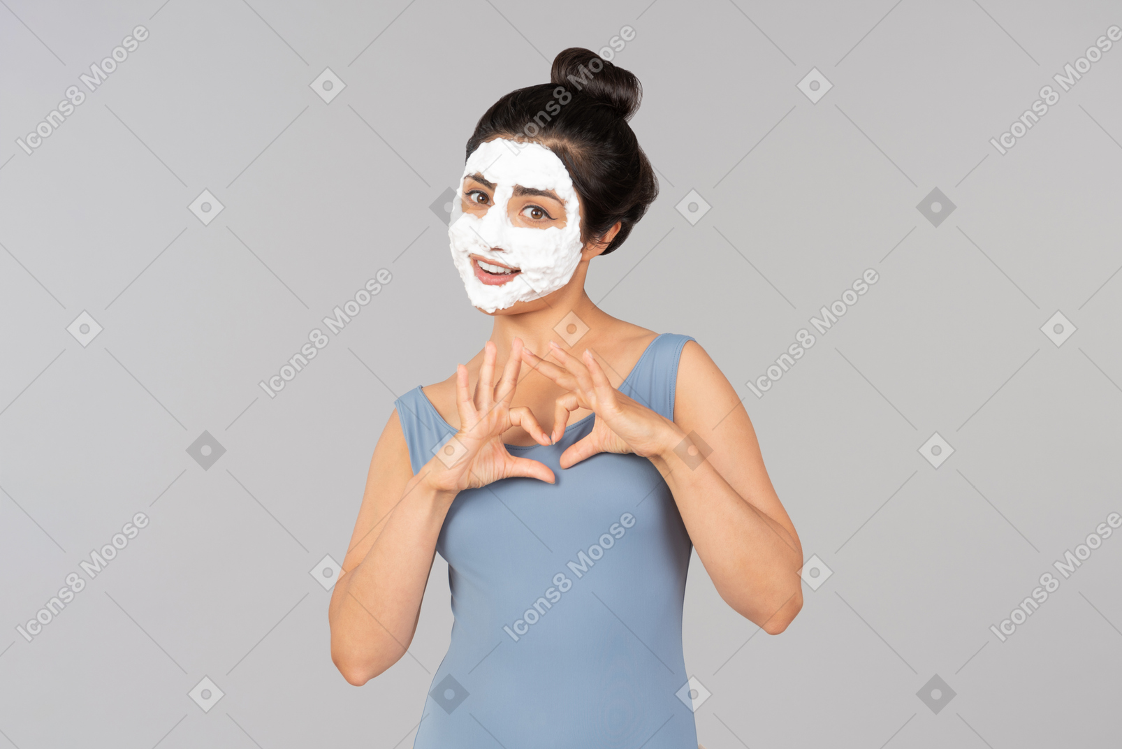 Woman with white mask on sending air kisses