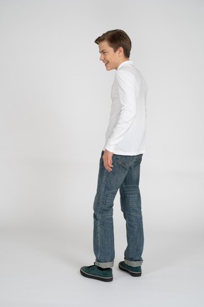 Young man in casual clothes standing