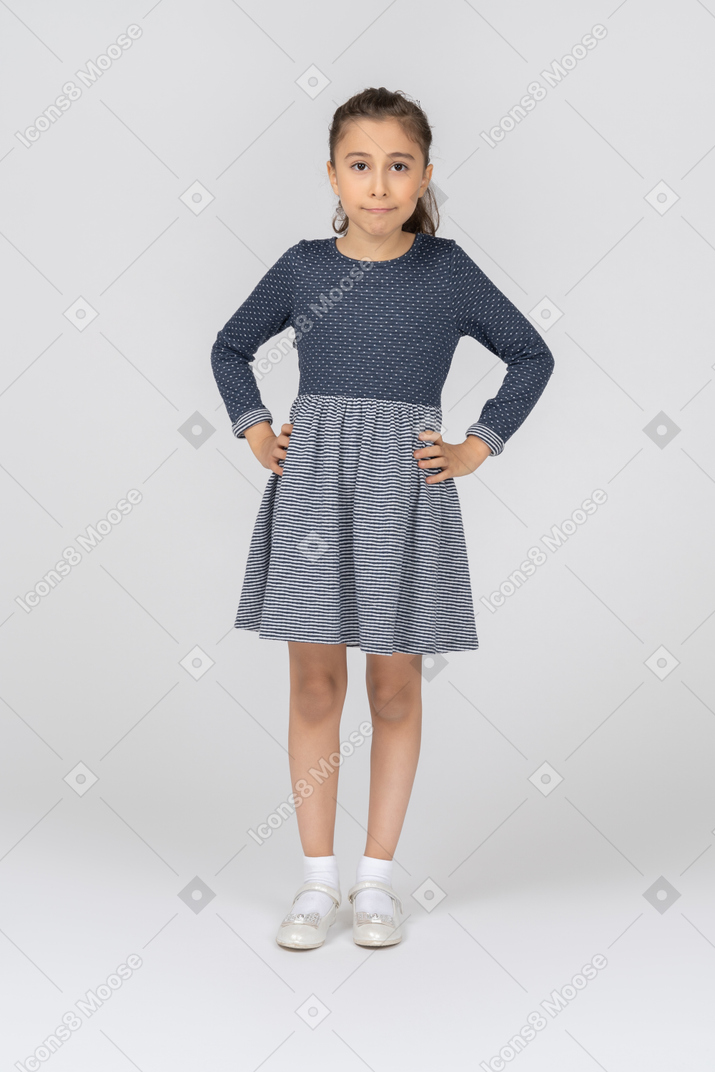 Front view of a girl holding hands on her hips