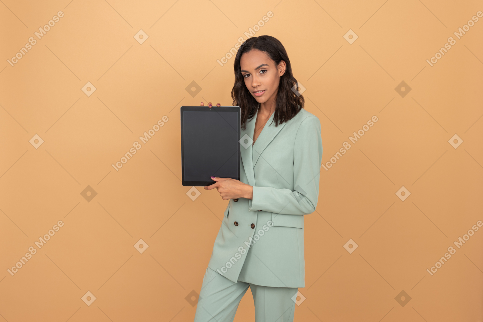 Attractive young woman showing a digital tablet