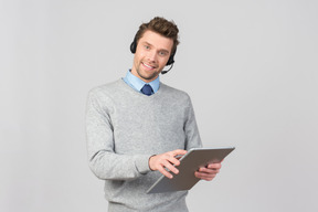 Call center agent working and holding folder