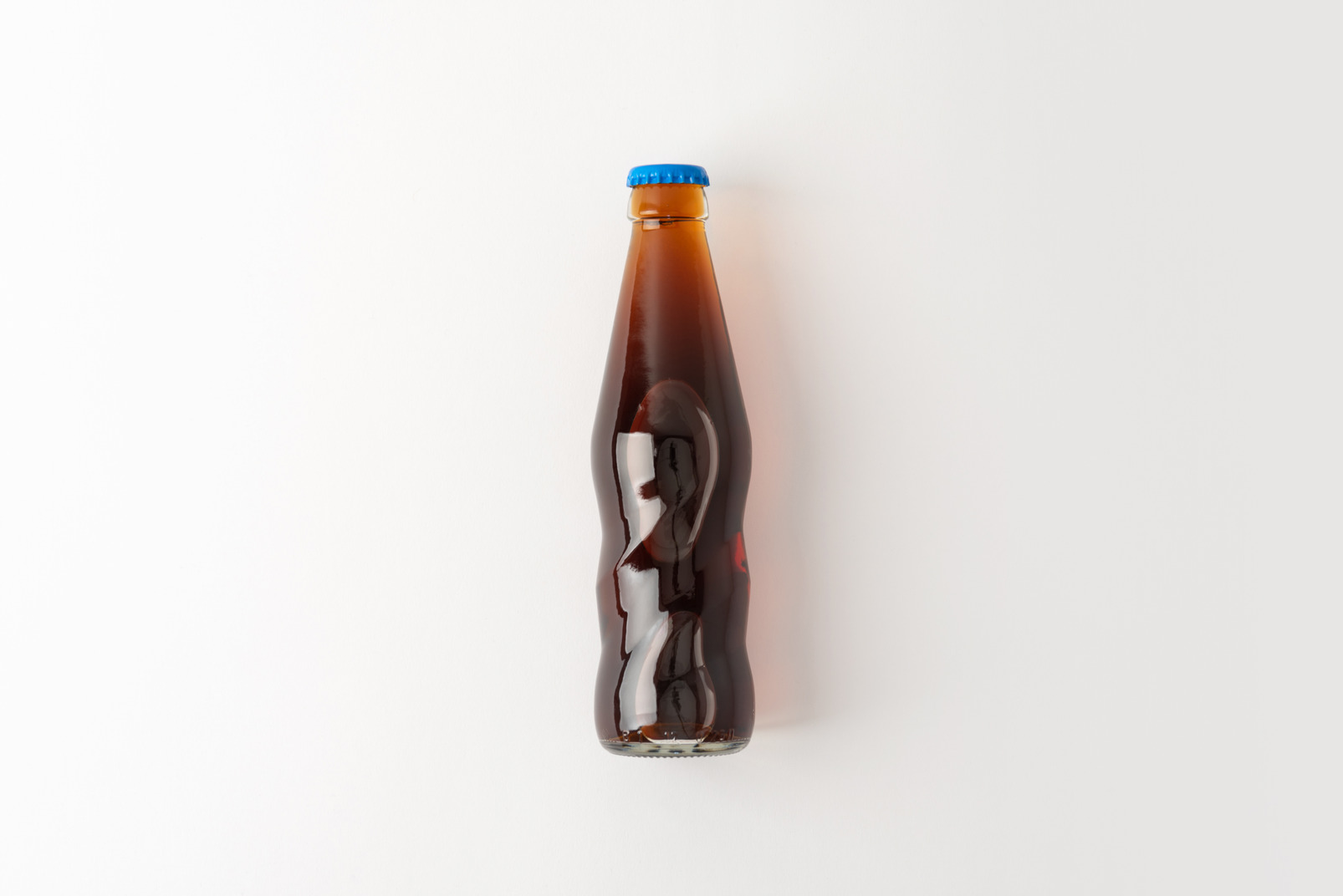Glass bottle with some soft drink