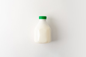 Small plastic bottle with some dairy product inside