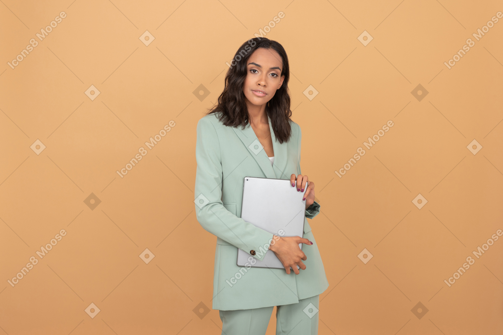Attractive young office worker holding a digital tablet