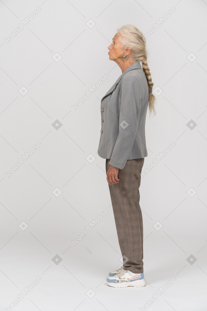 Old lady in suit posing in profile
