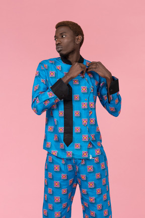 Black man in blue pajamas