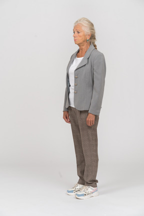 Side view of a beautiful old lady in suit