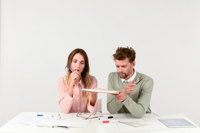 Architects sitting at the tablet and holding tablet