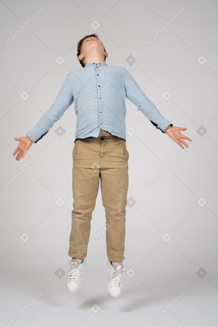 Young man jumping in an expressive way