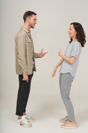 Side view of young couple speaking to each other