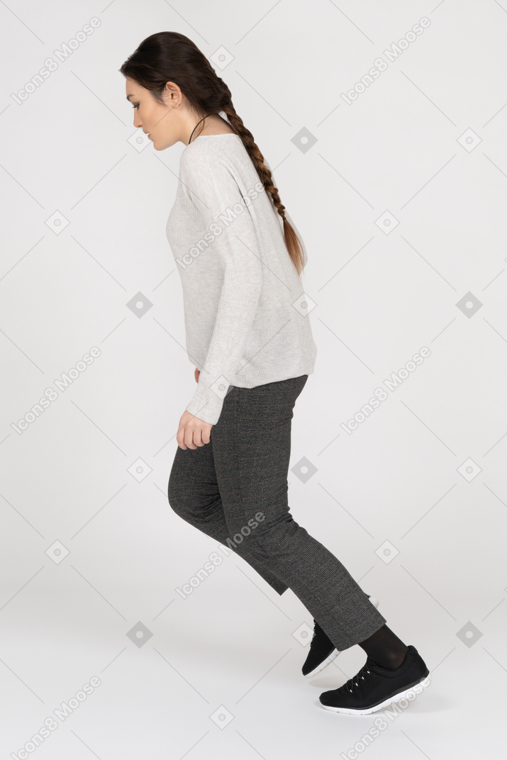 Woman is about to fall down on white background