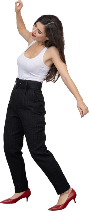 Full-length of a young female in office clothing raising hand and looking down