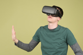 Young man using virtual reality headset