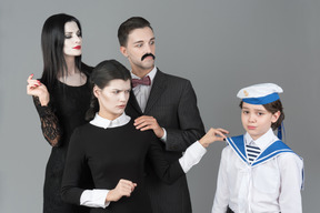 Addams family members don't recognize boy in sailor's uniform