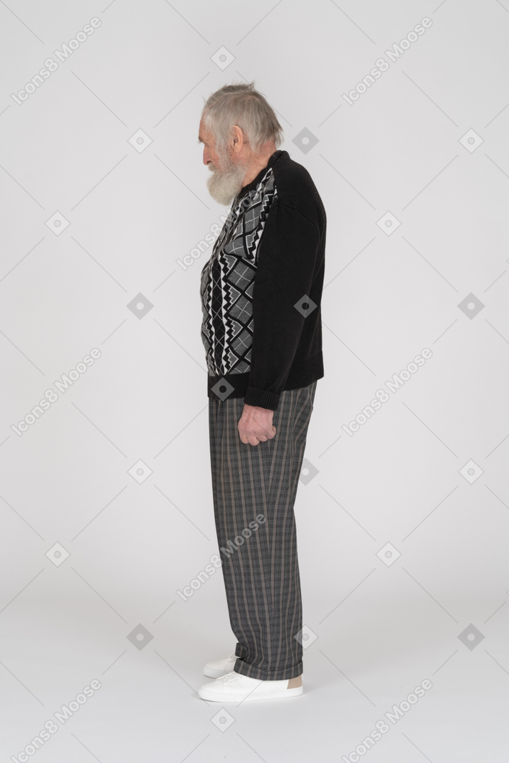 Side view of an old man looking down