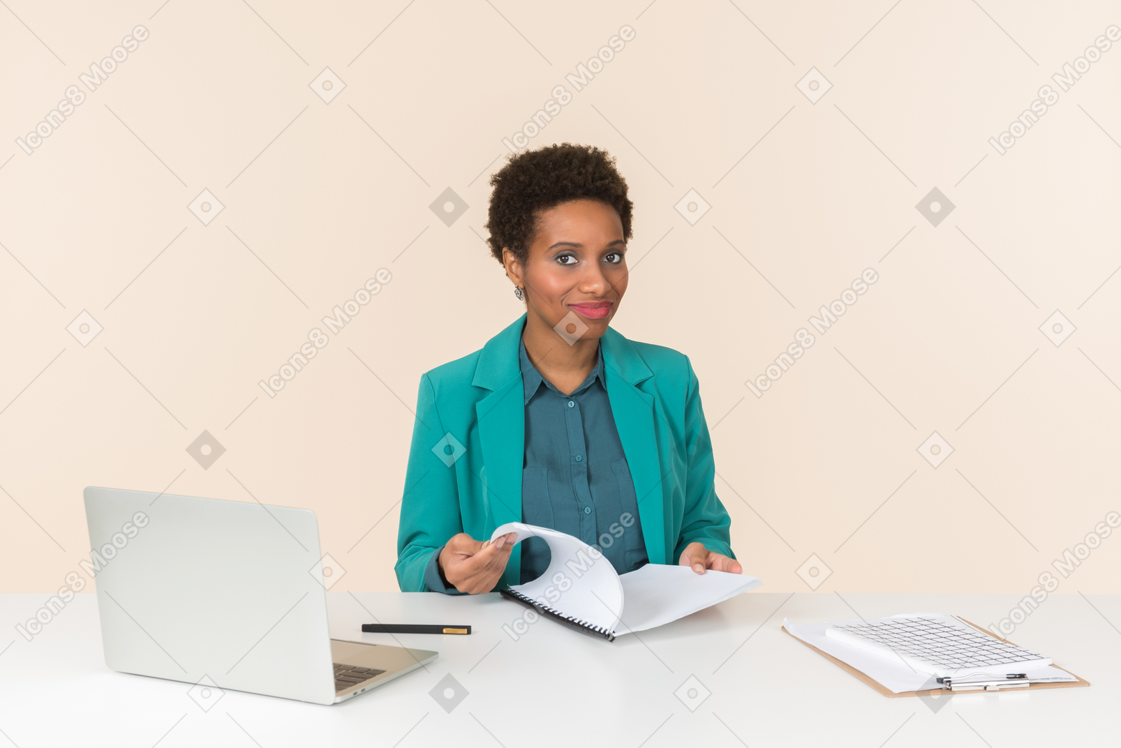 Female office employee sitting at the desk and checking papers