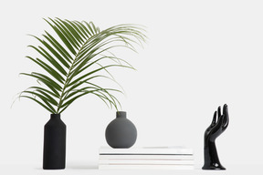 Black vase with palm branch