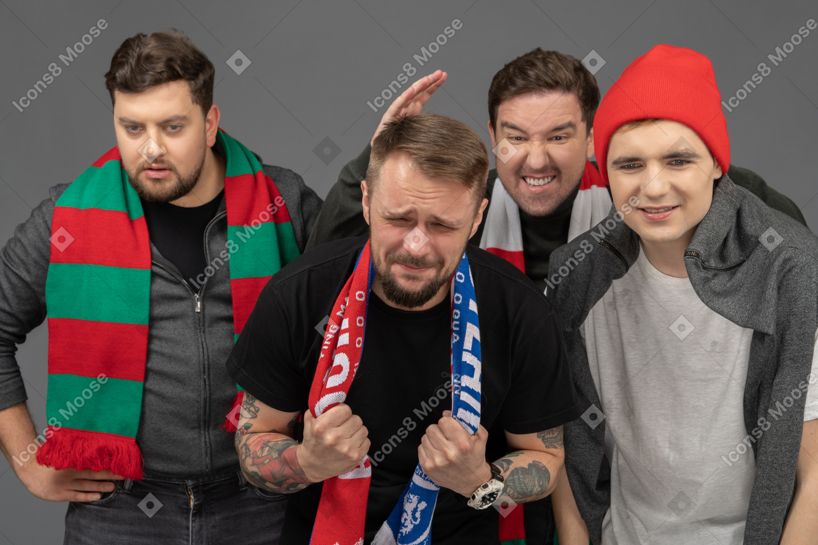 Close-up of four upset male football fans