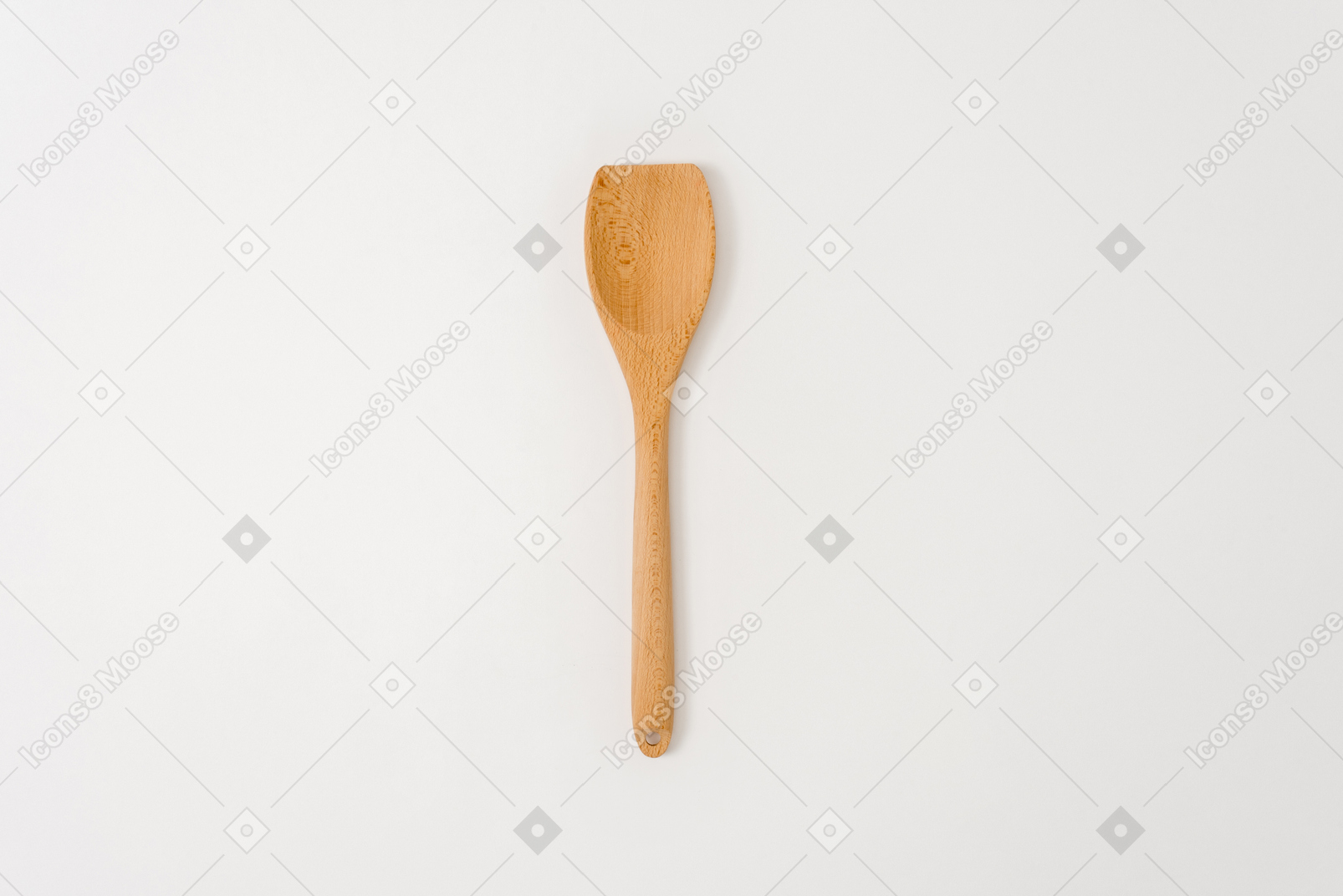 Cucchiaio di legno su sfondo bianco