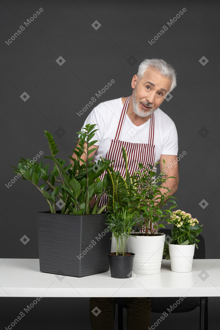 A gardener looking at camera