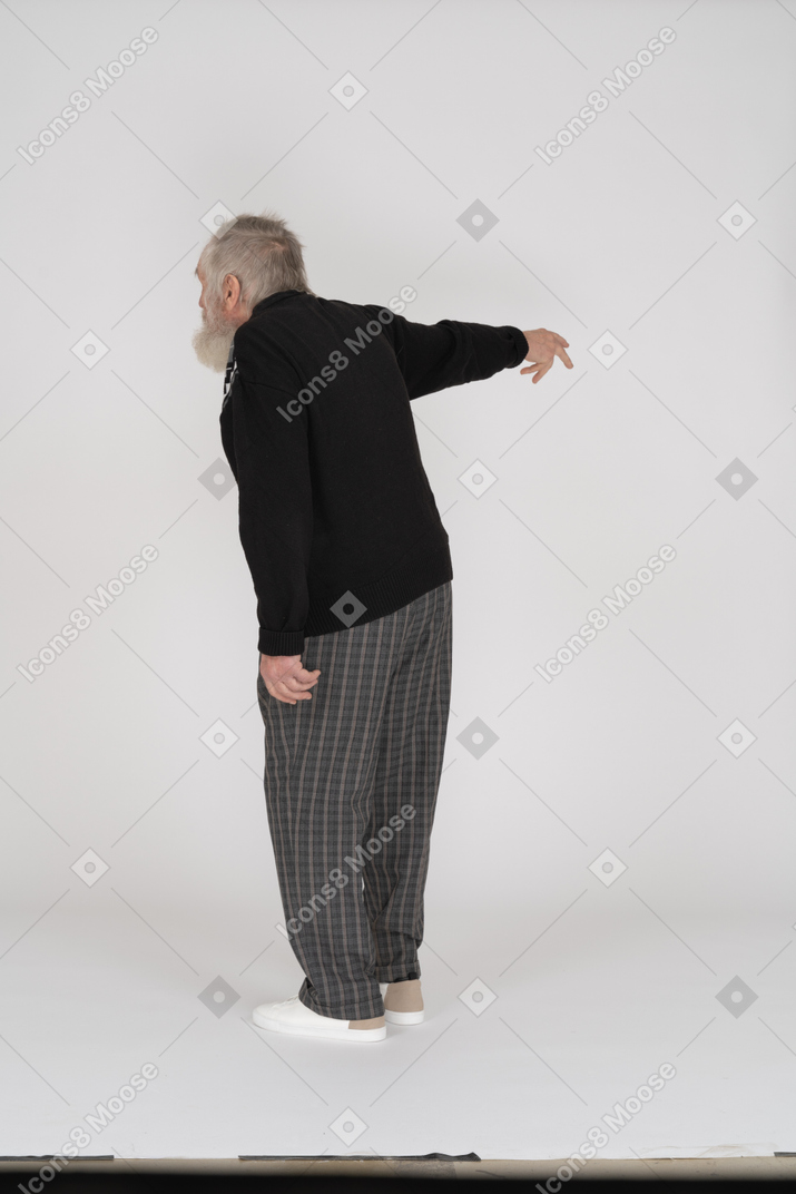 Old man complaining and pointing with arm