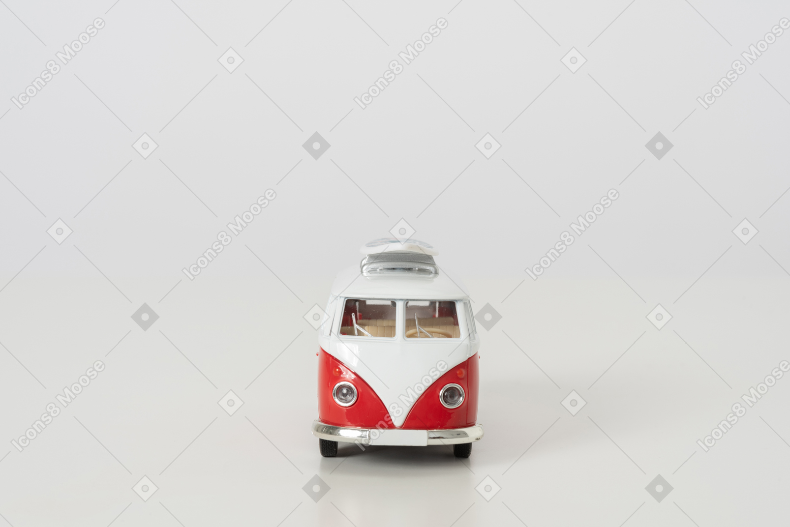 Toy hippie auto bus photographed on grey background