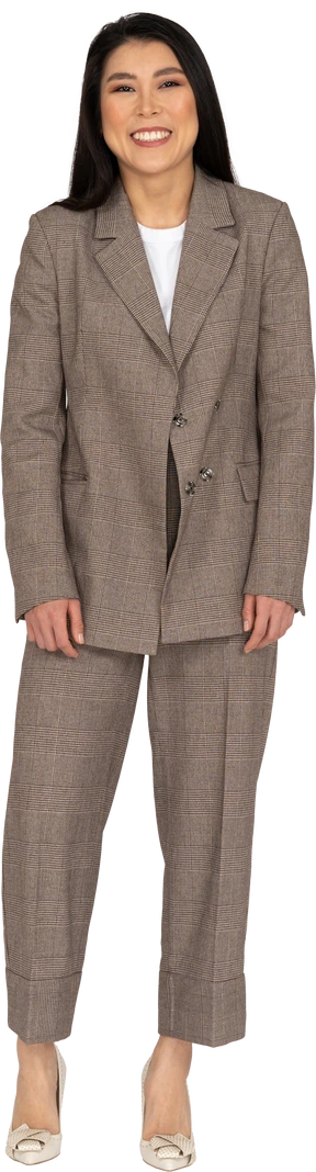 Front view of a laughing young lady in brown business suit