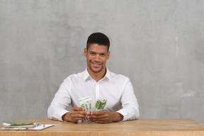 Young man counting his money