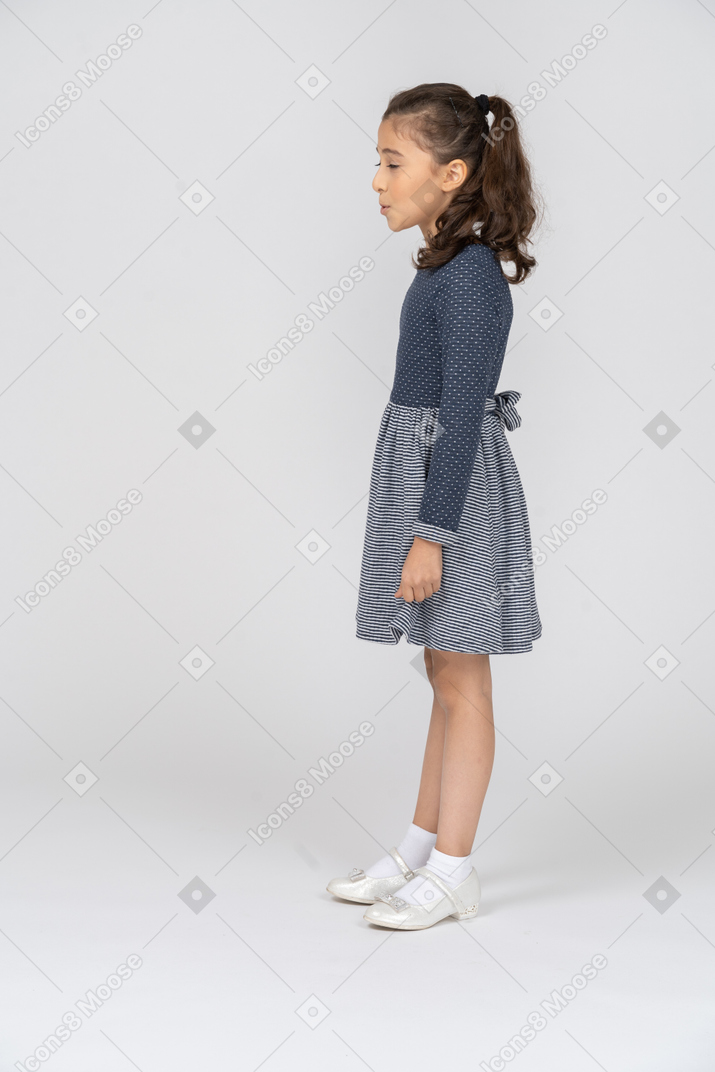 Side view of a girl saying something with her eyes closed