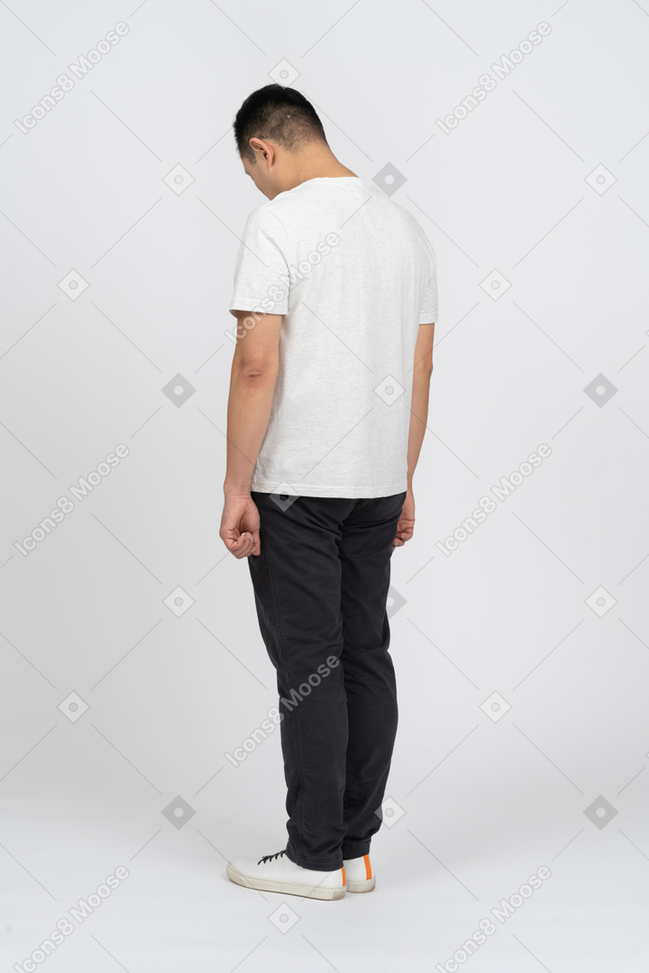 Man in casual clothes bending head down