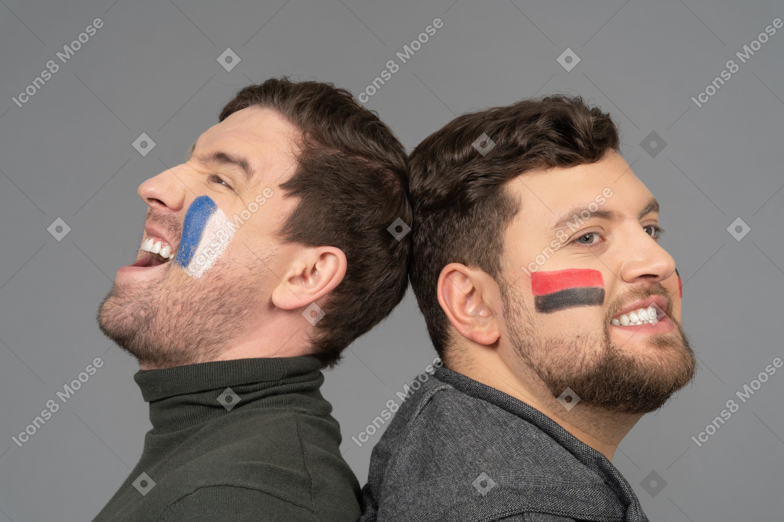 Side view of two emotional male football fans