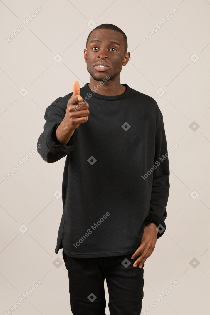 Worried young man talking and gesturing