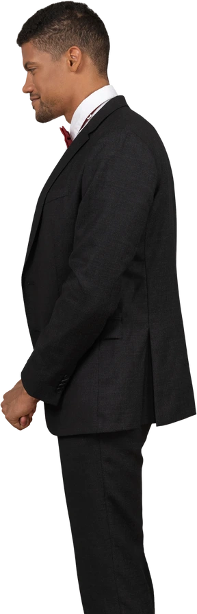 Man in black suit standing