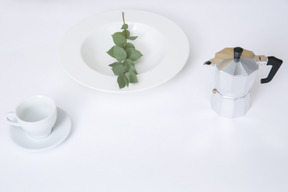 White plate, white cup and coffee pot