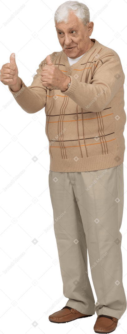 Front view of a happy old man in casual clothes showing thumbs up