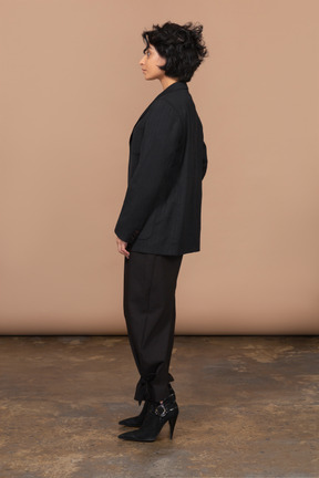 Side view of a businesswoman dressed in black suit