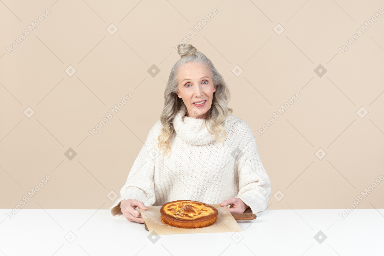Elegant old woman pleased with a freshly baked pie