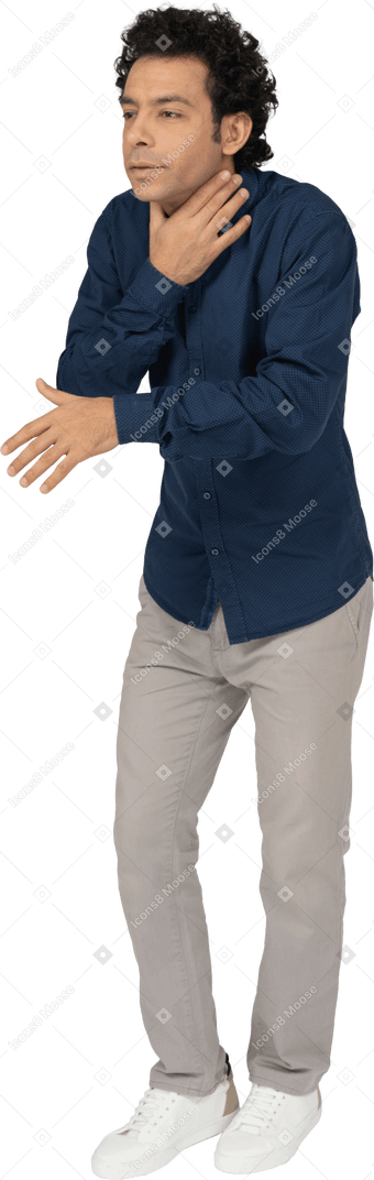 Front view of a man in casual clothes choking himself