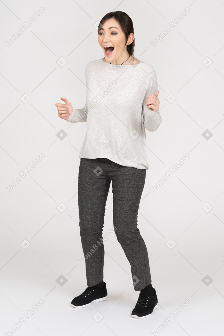 Excited happy young woman isolated over white background