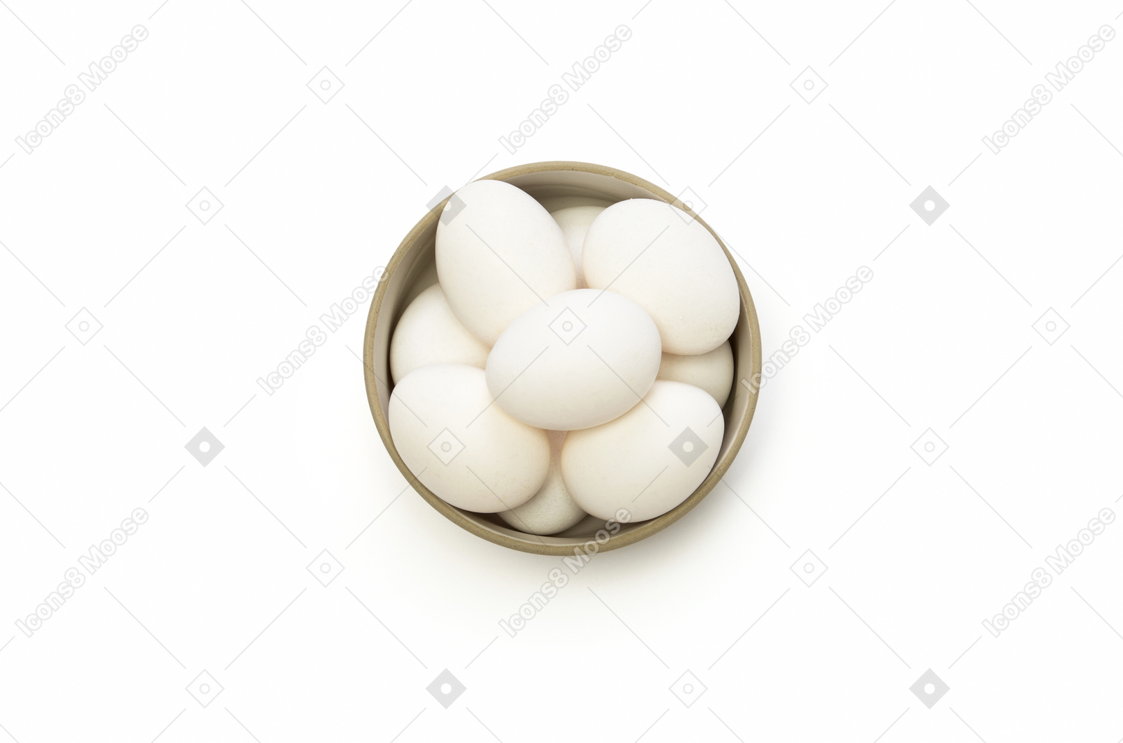 White chicken eggs in a ceramic bowl