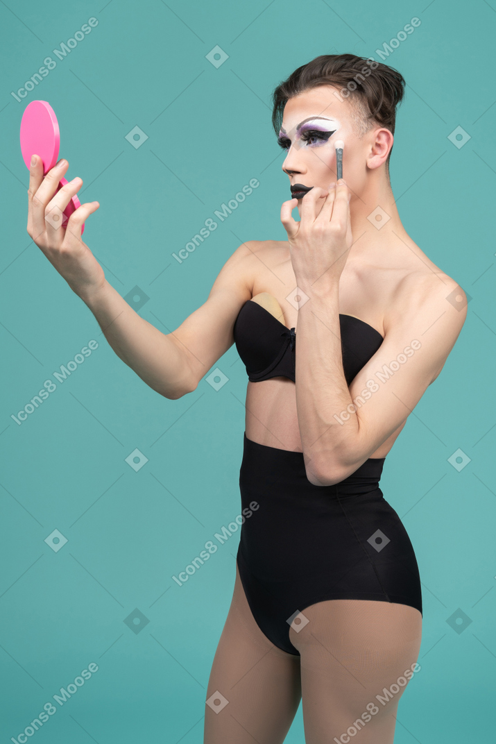 Drag queen putting on make up