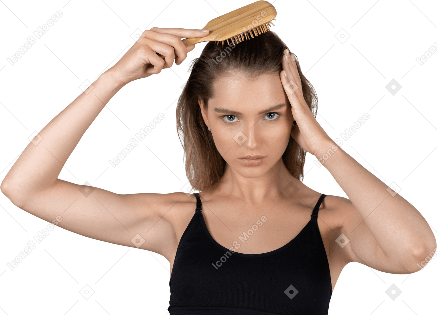 Vista frontale di una giovane donna che si spazzola i capelli